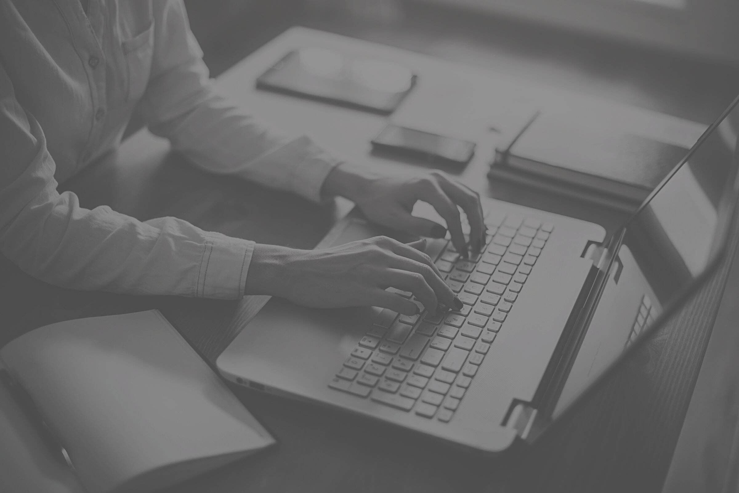 Female working with laptop at home woman's hands on