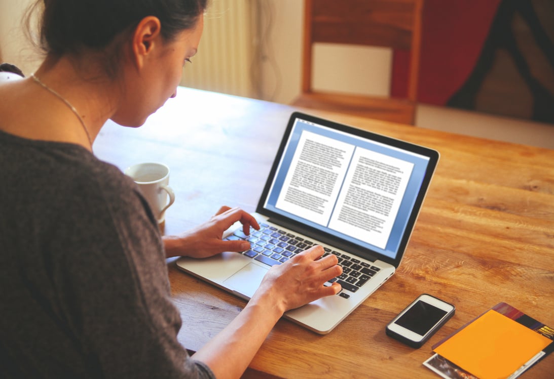 Female novelist writing on the laptop