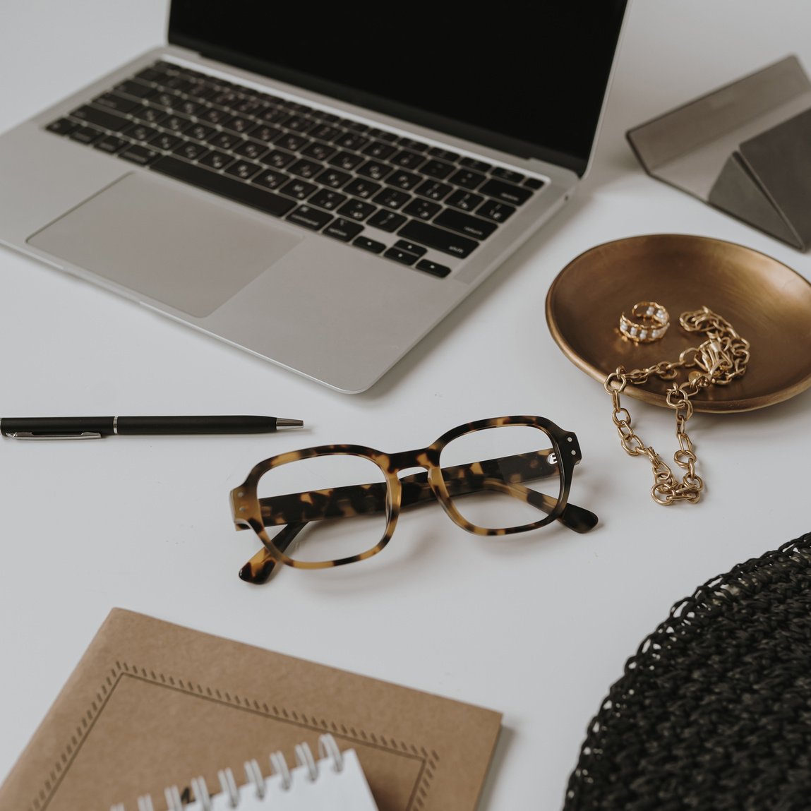 Workspace with Laptop, Glasses, and Jewelry Dish